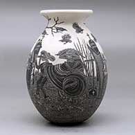 A black on white jar with a rolled lip and decorated with a sgraffito Day of the Dead at the Cemetery design, click or tap to see a larger version