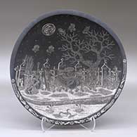 A black on white shallow bowl decorated inside with a sgraffito Day of the Dead at the the Cemetery and geometric design
 by Hector Javier Martinez of Mata Ortiz and Casas Grandes