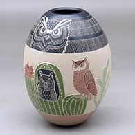 A polychrome jar decorated with a sgraffito and painted owl, cactus, flower and geometric design
 by Mariela Tena of Mata Ortiz and Casas Grandes