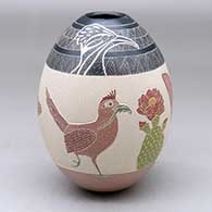 A polychrome jar decorated with a sgraffito and painted roadrunner, cactus, flower and geometric design
 by Mariela Tena of Mata Ortiz and Casas Grandes