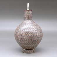 A polychrome medium necked lidded jar with a custom matching stand, all decorated with a fineline geometric design, click or tap to see a larger version