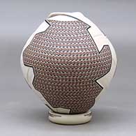 A polychrome jar with a geometric cut opening and decorated with a lightly carved, sgraffito and painted geometric design, with a custom matching stand, click or tap to see a larger version