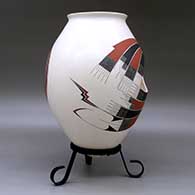 A polychrome jar with two cutouts and decorated with a two-panel geometric design, click or tap to see a larger version