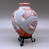 A polychrome jar with a short neck and decorated with a three panel geometric design, click or tap to see a larger version