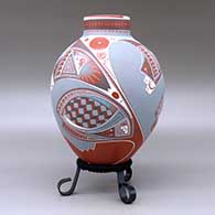 A polychrome jar with a short neck and decorated with a three panel geometric design, click or tap to see a larger version