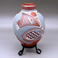 A polychrome jar with a short neck and decorated with a three panel geometric design
 by Rocio Silveira of Mata Ortiz and Casas Grandes