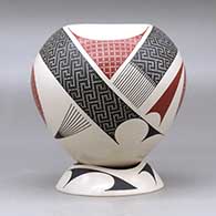 A polychrome jar decorated with a two panel tiny square and geometric design, plus a custom matching stand, click or tap to see a larger version