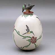 A polychrome jar decorated with a sgraffito and painted hummingbird, flower and vine design, plus a hummingbird lid, click or tap to see a larger version
