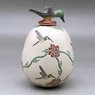 A polychrome jar decorated with a sgraffito and painted hummingbird, flower and vine design, plus a hummingbird lid, click or tap to see a larger version