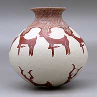 A red on white jar with a rolled lip and decorated with a sgraffito deer and geometric design, click or tap to see a larger version
