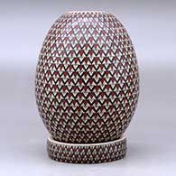 A polychrome jar with a matching custom stand, all decorated with a geometric design, click or tap to see a larger version