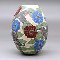 A polychrome jar decorated with a sgraffito and painted hummingbird, butterfly, flower, leaf and branch design, click or tap to see a larger version