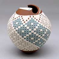 A polychrome jar with a geometric cut opening and decorated with a four panel checkerboard, fineline and geometric design
 by Florencia Sanchez of Mata Ortiz and Casas Grandes