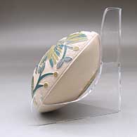 A polychrome seed pot decorated with a lightly carved, sgraffito and painted hummingbird, vine, flower and berry design, click or tap to see a larger version