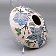 A polychrome seed pot decorated with a lightly carved, sgraffito and painted hummingbird, vine, flower and berry design, click or tap to see a larger version