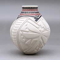 A polychrome vase decorated with a carved hummingbird, dragonfly and geometric design around the body and a sgraffito and painted geometric design around the short neck, click or tap to see a larger version