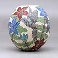A polychrome jar decorated with a sgraffito and painted hummingbird, butterfly, flower, leaf and branch design, click or tap to see a larger version