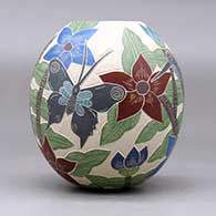 A polychrome jar decorated with a sgraffito and painted hummingbird, butterfly, flower, leaf and branch design, click or tap to see a larger version