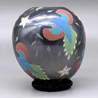 A polychrome jar decorated with a sgraffito and painted bird, flower and vine design, click or tap to see a larger version