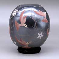 A polychrome jar decorated with a sgraffito and painted hummingbird, flower and vine design, click or tap to see a larger version