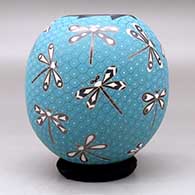 A polychrome jar decorated with a sgraffito and painted dragonfly and geometric mesh design, click or tap to see a larger version