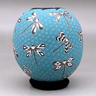 A polychrome jar decorated with a sgraffito and painted dragonfly and geometric mesh design, click or tap to see a larger version