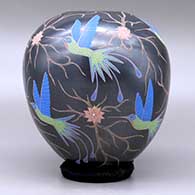 A polychrome jar decorated with a sgraffito and painted hummingbird, flower and vine design, click or tap to see a larger version