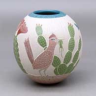 A polychrome jar decorated with a sgraffito and painted roadrunner, owl, quail, cactus and geometric design
 by Mariela Tena of Mata Ortiz and Casas Grandes