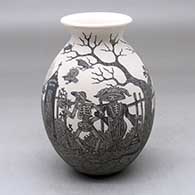 A black on white jar with a rolled lip and decorated with a sgraffito Day of the Dead at the Cemetery design
 by Hector Javier Martinez of Mata Ortiz and Casas Grandes