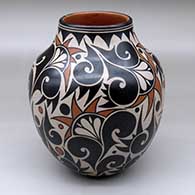 A polychrome jar decorated with a four-panel geometric design
 by Lisa Holt of Cochiti