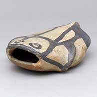 A polychrome reptilian figure
 by Unknown of Cochiti