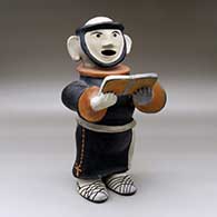 A standing polychrome Padre figure reading from a book
 by Louis Naranjo of Cochiti