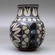 A polychrome jar with handles and decorated with a geometric design around the body, click or tap to see a larger version