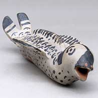 A black on white fish figure
 by Unknown of Cochiti