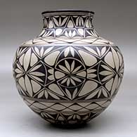 A polychrome jar decorated with a geometric design, click or tap to see a larger version