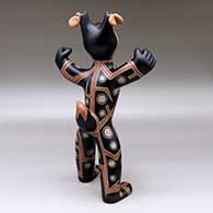 Standing polychrome coyote figure with earrings and a geometric design, click or tap to see a larger version