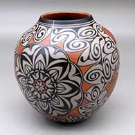 A polychrome jar decorated with a four panel medallion, rose, spiral and geometric design
 by Lisa Holt of Cochiti