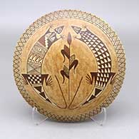 Polychrome seed pot with a lizard, cornstalk, fine line, and geometric design
 by Nona Naha of Hopi