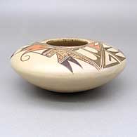 Polychrome jar with a geometric design, click or tap to see a larger version