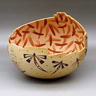 An open polychrome bowl with a step-cut opening and decorated inside with brushes of color and decorated outside with dragonflies, katsinas, bird element, stars and geometric design
 by Garrett Maho of Hopi