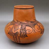 A black-on-red jar with a tall neck and decorated with a four-panel eagle tail and geometric design
 by Dee Setalla of Hopi