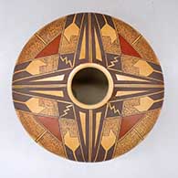 A polychrome seed pot decorated with a four-panel geometric design above the shoulder
 by Loren Ami of Hopi