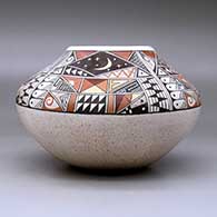 A polychrome jar decorated with a four-panel phases of the moon and geometric design above the shoulder, click or tap to see a larger version