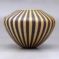 A polychrome jar decorated with a medallion, bird element and geometric design, click or tap to see a larger version