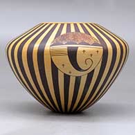 A polychrome jar decorated with a medallion, bird element and geometric design, click or tap to see a larger version