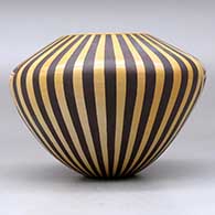A polychrome jar decorated with a medallion, bird element and geometric design, click or tap to see a larger version