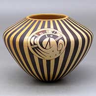 A polychrome jar decorated with a medallion, bird element and geometric design
 by Garrett Maho of Hopi