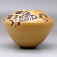 A polychrome jar decorated with a two-panel stylized parrot and geometric design, above the shoulder, click or tap to see a larger version