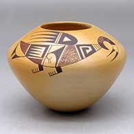A polychrome jar decorated with a two-panel stylized parrot and geometric design, above the shoulder
 by Garrett Maho of Hopi