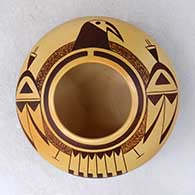 A high shouldered polychrome bowl decorated with a thunderbird design above the shoulder
 by Garrett Maho of Hopi